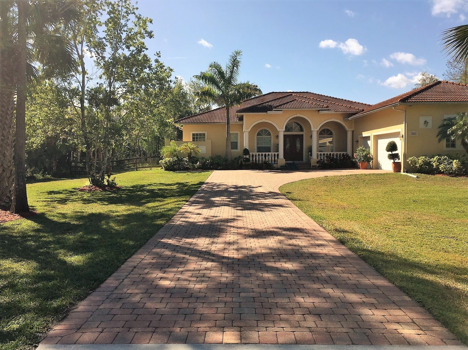 Front exterior and driveway of Bear Country Living in Naples, Florida